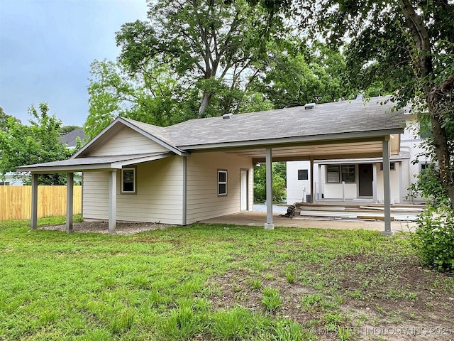 525 W Downing St, Tahlequah, OK 74464 - back of house with a patio area and an attached carport
