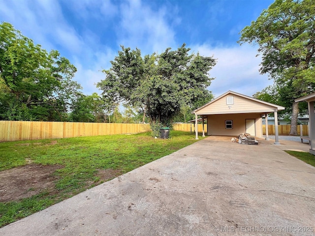 525 W Downing St, Tahlequah, OK 74464 - view of yard with a carport and concrete driveway