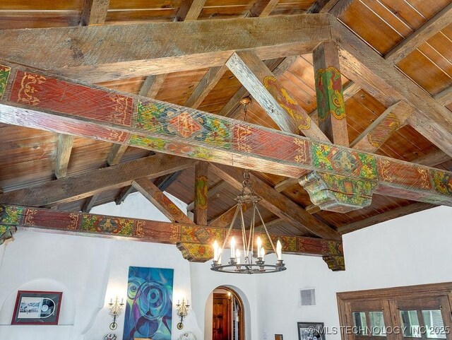 detailed view of arched walkways, beamed ceiling, wood ceiling, and a chandelier