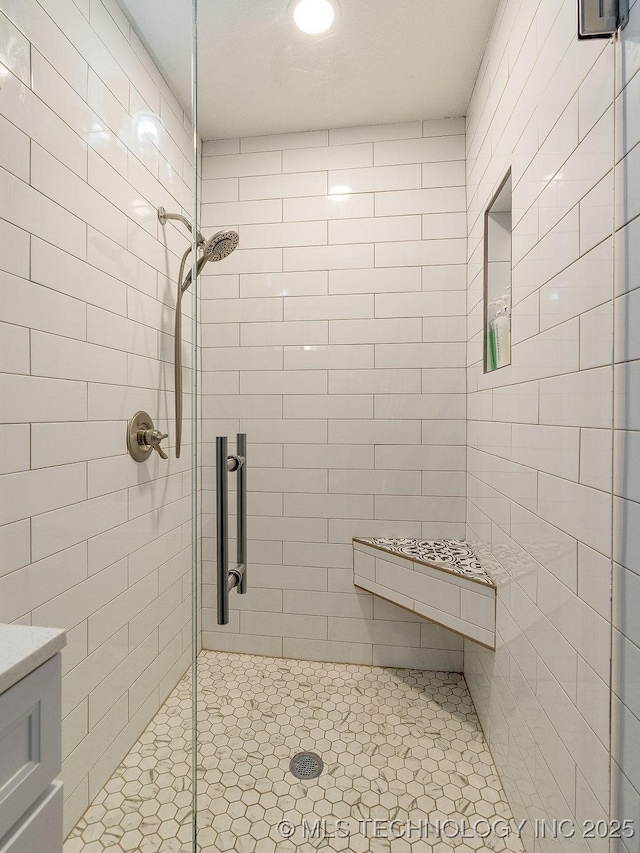 bathroom with a shower stall