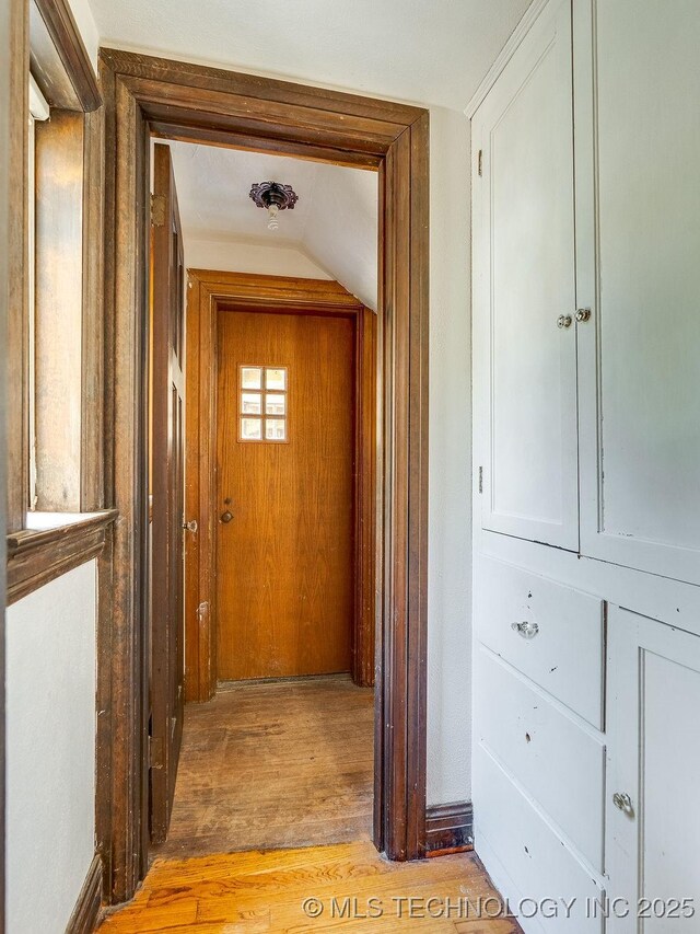 corridor featuring light wood-style floors