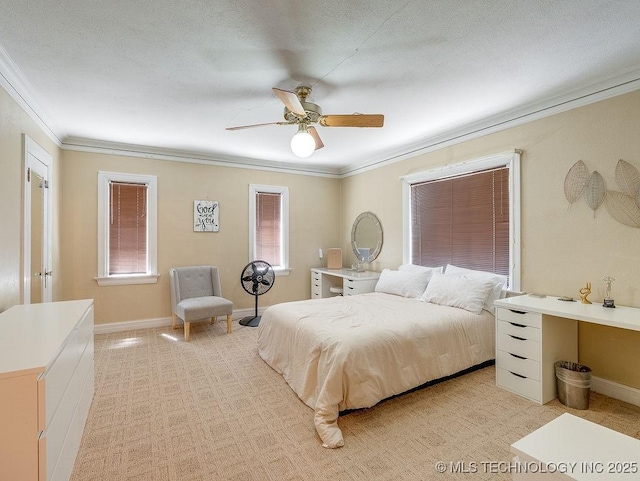 bedroom featuring ornamental molding, light carpet, baseboards, and a ceiling fan