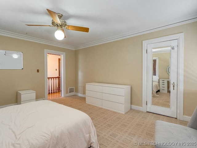 bedroom featuring crown molding, light carpet, and ceiling fan