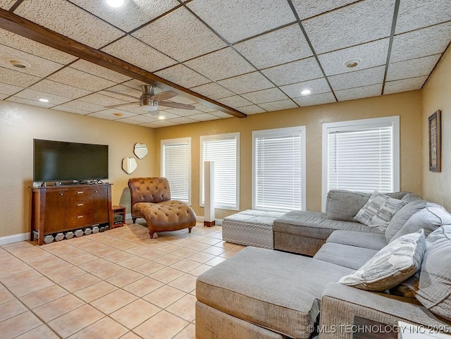 living area with light tile patterned floors, a ceiling fan, baseboards, and recessed lighting