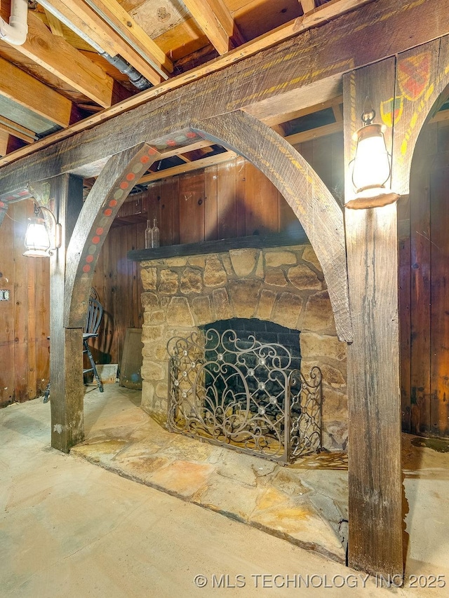 unfurnished living room with a stone fireplace