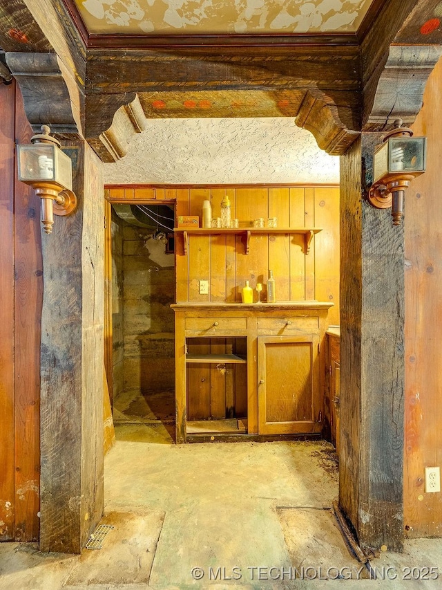 bar area featuring wooden walls