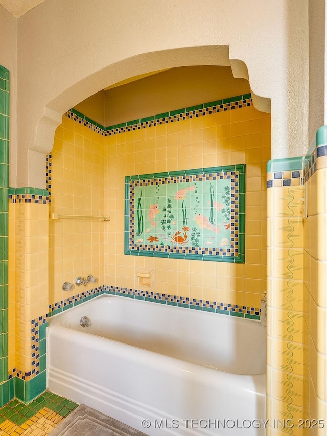 full bathroom featuring a tub and a shower