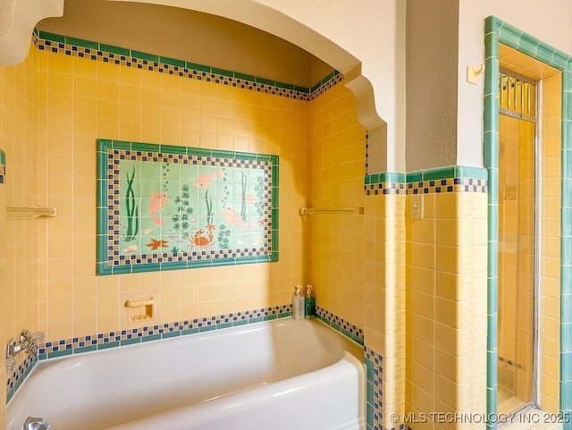 full bathroom with a tub