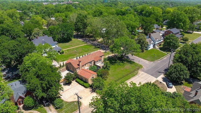 aerial perspective of suburban area with a heavily wooded area