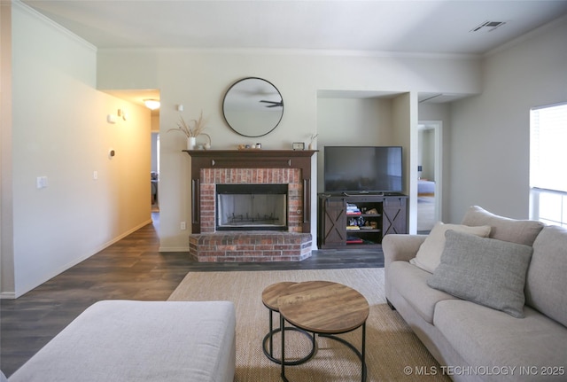 3983 S 216th E Ave, Broken Arrow, OK 74014 - living area with crown molding, wood finished floors, baseboards, and a fireplace