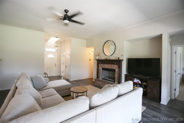 3983 S 216th E Ave, Broken Arrow, OK 74014 - living area featuring a ceiling fan, dark wood-style floors, ornamental molding, and a fireplace