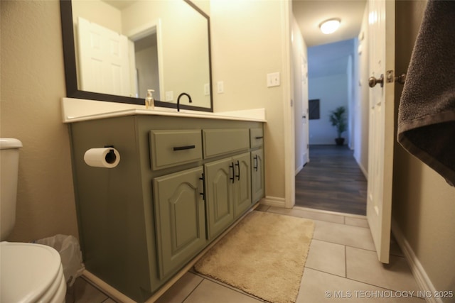 3983 S 216th E Ave, Broken Arrow, OK 74014 - bathroom featuring toilet, vanity, tile patterned floors, and baseboards