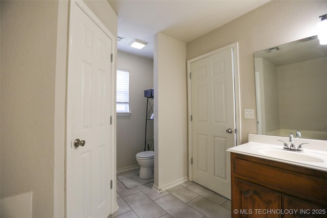 3983 S 216th E Ave, Broken Arrow, OK 74014 - bathroom featuring vanity, toilet, and tile patterned floors