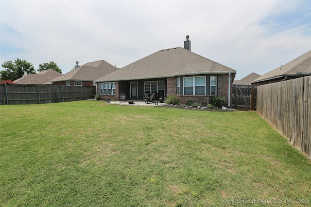 3983 S 216th E Ave, Broken Arrow, OK 74014 - back of house with brick siding, a patio, and a chimney