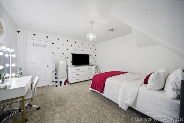 bedroom with a chandelier and carpet floors