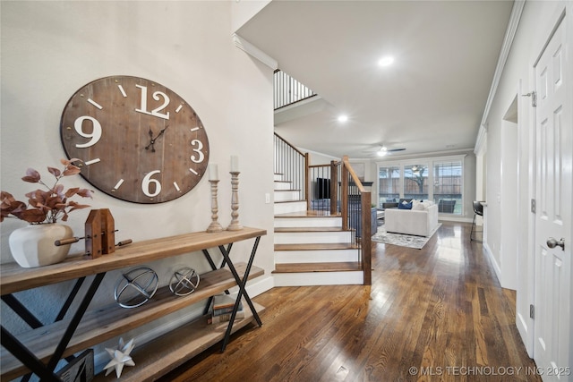 entryway featuring baseboards, stairs, wood finished floors, and a ceiling fan