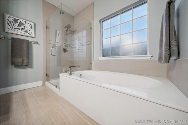 3001 S Tamarack Ave, Broken Arrow, OK 74012 - full bath featuring a bath, a stall shower, and baseboards