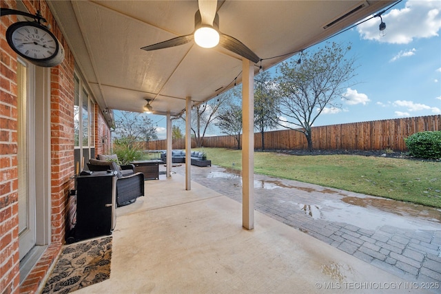 view of patio with ceiling fan and an outdoor living space