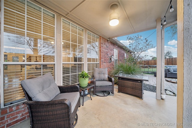 view of patio / terrace featuring fence