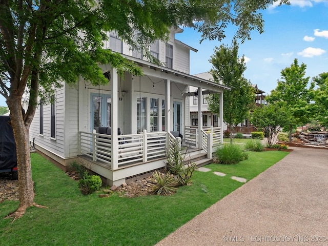 40 Center Ln N, Carlton Landing, OK 74432 - view of side of property featuring covered porch and a lawn