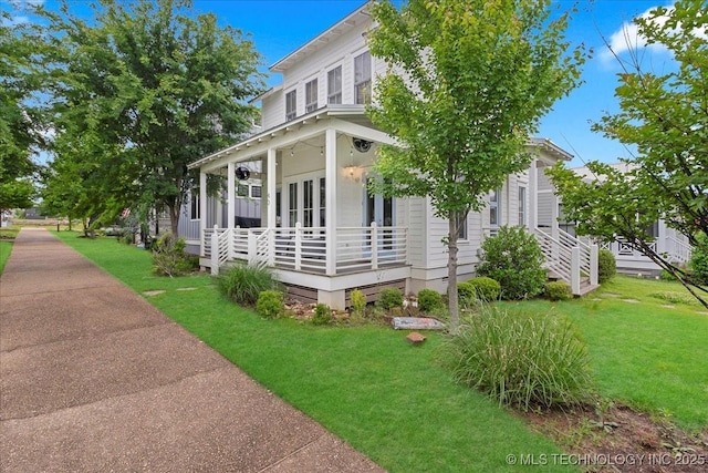 40 Center Ln N, Carlton Landing, OK 74432 - view of home's exterior featuring a lawn and a porch