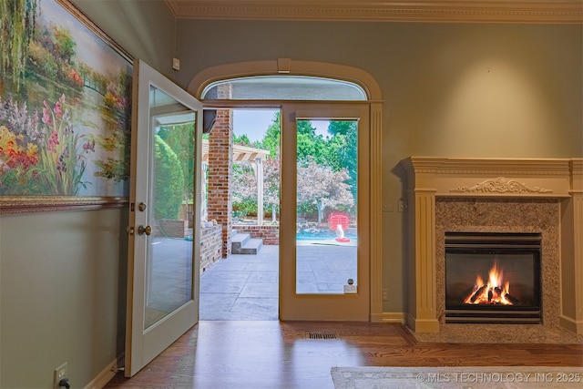 3107 E 88th St, Tulsa, OK 74137 - doorway to outside featuring wood finished floors and a premium fireplace