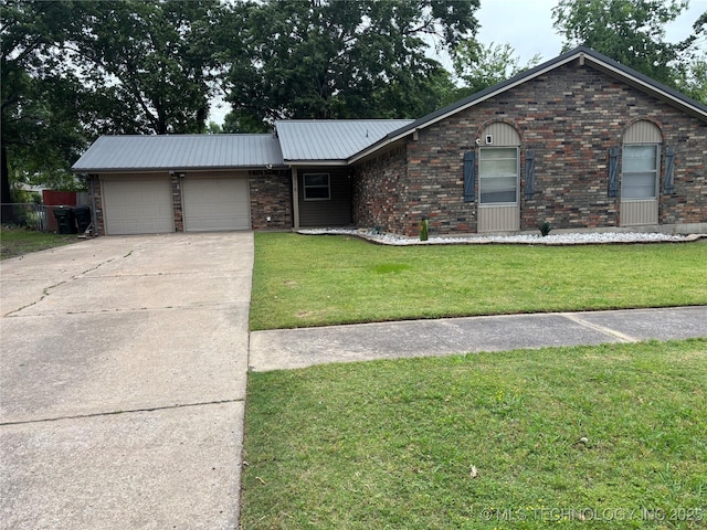 316 Barclay, Muskogee, OK 74403 - single story home with an attached garage, brick siding, a front yard, and concrete driveway