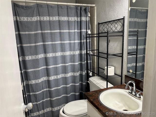 316 Barclay, Muskogee, OK 74403 - full bath featuring a textured wall, toilet, vanity, and a shower with curtain