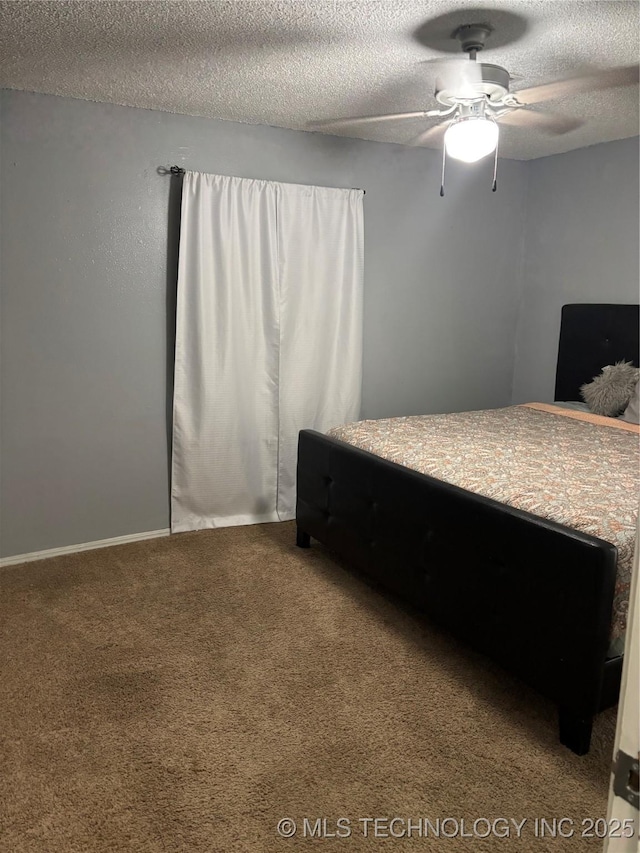 316 Barclay, Muskogee, OK 74403 - bedroom featuring carpet floors, a textured ceiling, and ceiling fan