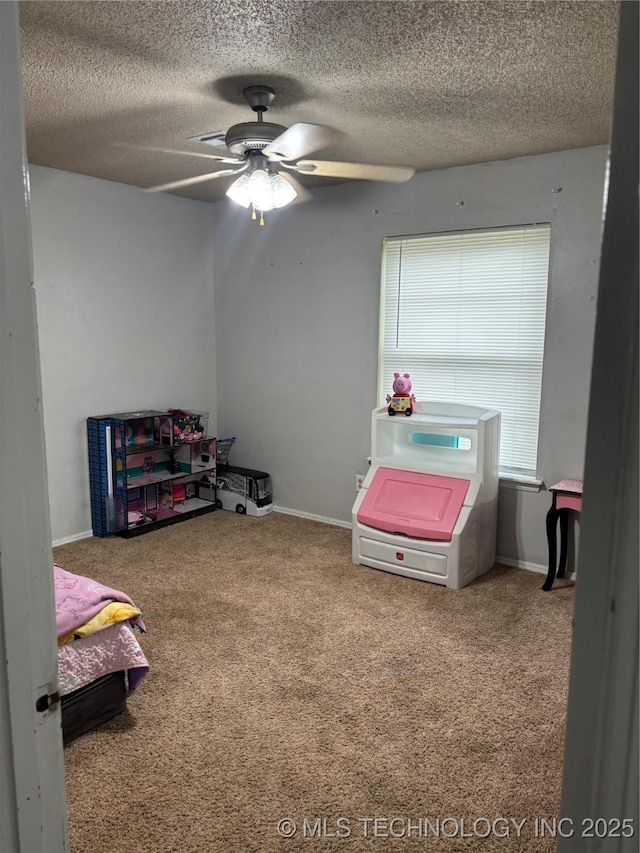 316 Barclay, Muskogee, OK 74403 - bedroom featuring carpet floors, a textured ceiling, baseboards, and a ceiling fan