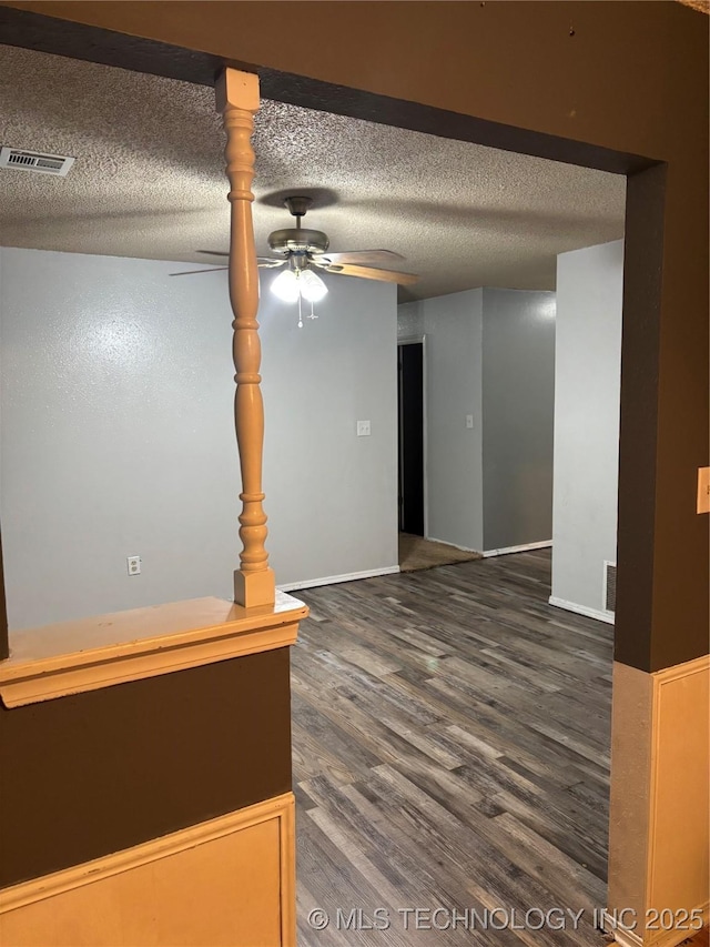 316 Barclay, Muskogee, OK 74403 - empty room featuring dark wood-style floors, a ceiling fan, a textured ceiling, and baseboards