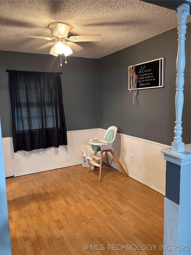 316 Barclay, Muskogee, OK 74403 - spare room with ceiling fan, a textured ceiling, and wood finished floors