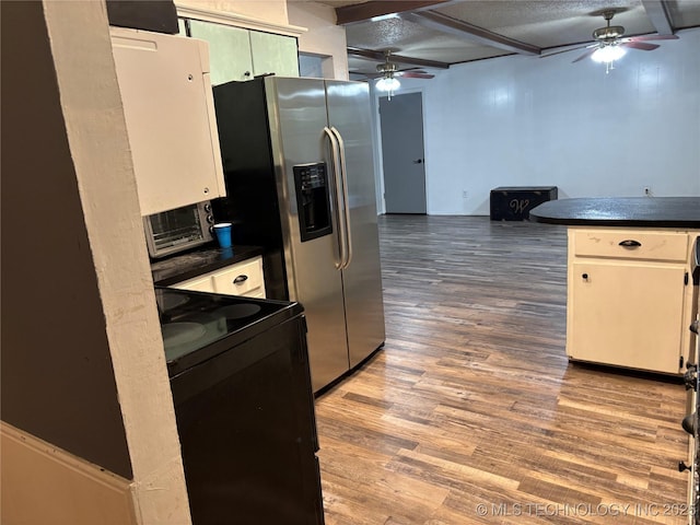 316 Barclay, Muskogee, OK 74403 - kitchen featuring a ceiling fan, black range with electric cooktop, stainless steel refrigerator with ice dispenser, and wood finished floors