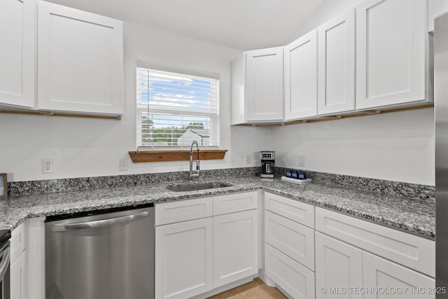 11879 Sandy Acres Trl, Kingston, OK 73439 - kitchen featuring stainless steel dishwasher, a sink, and white cabinetry