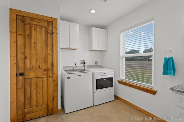 11879 Sandy Acres Trl, Kingston, OK 73439 - laundry room with cabinet space, washer and clothes dryer, and baseboards