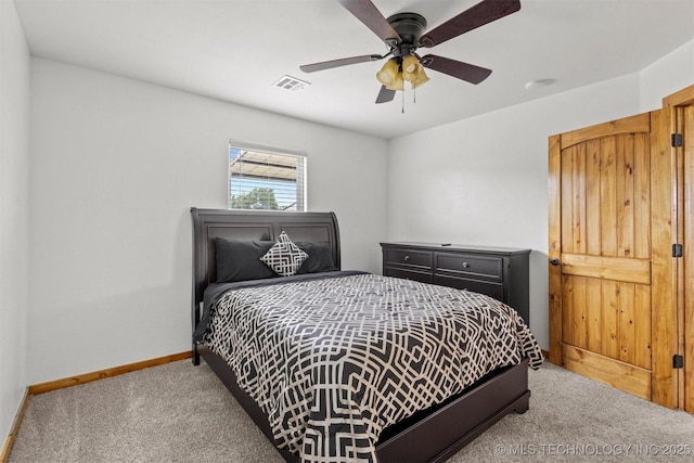 11879 Sandy Acres Trl, Kingston, OK 73439 - carpeted bedroom with baseboards and a ceiling fan