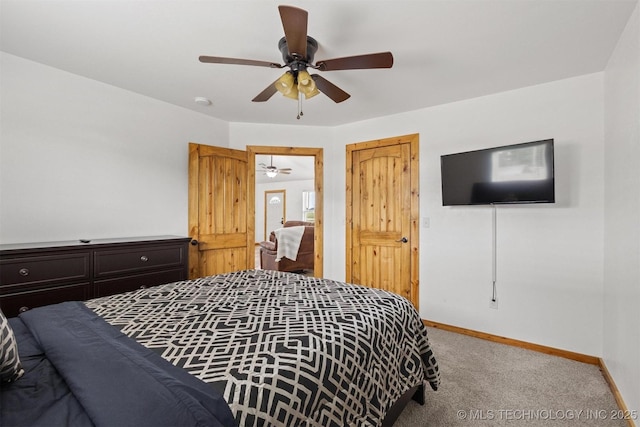 11879 Sandy Acres Trl, Kingston, OK 73439 - bedroom featuring light carpet, baseboards, and a ceiling fan