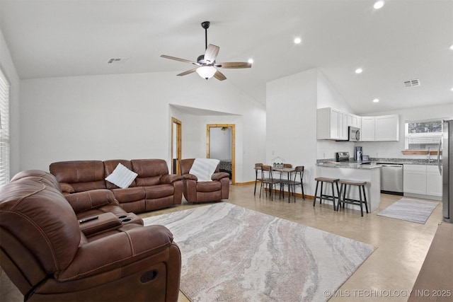 11879 Sandy Acres Trl, Kingston, OK 73439 - living area featuring vaulted ceiling, finished concrete floors, a ceiling fan, and recessed lighting