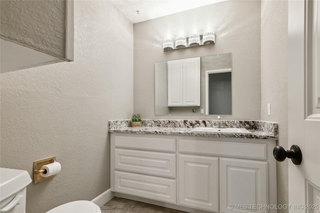 802 E Seneca St, Tahlequah, OK 74464 - bathroom with toilet, vanity, and a textured wall