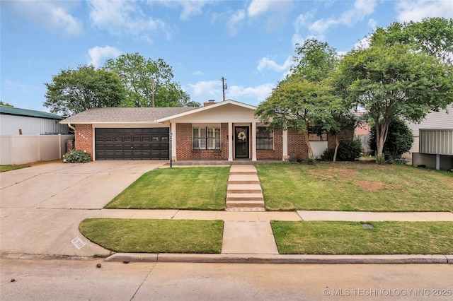 1919 NW 10th St, Ardmore, OK 73401 - view of front of property with brick siding, a garage, and concrete driveway