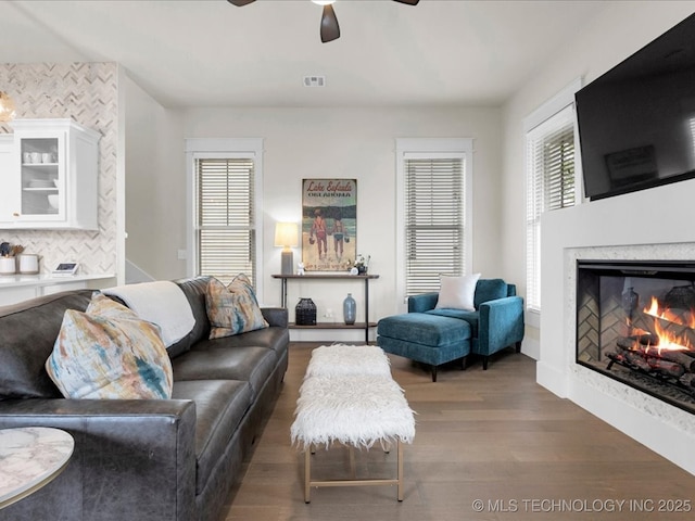 42 Redbud St, Carlton Landing, OK 74432 - living area featuring a ceiling fan, wood finished floors, and plenty of natural light