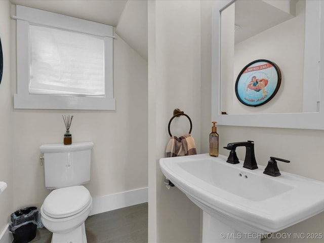 42 Redbud St, Carlton Landing, OK 74432 - bathroom featuring wood finished floors, baseboards, toilet, and a sink