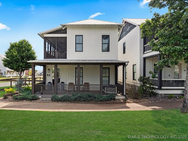 42 Redbud St, Carlton Landing, OK 74432 - view of front of home featuring a front yard, covered porch, and a sunroom
