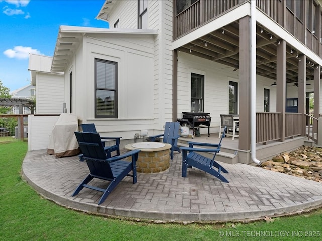 42 Redbud St, Carlton Landing, OK 74432 - view of patio featuring an outdoor fire pit and a balcony