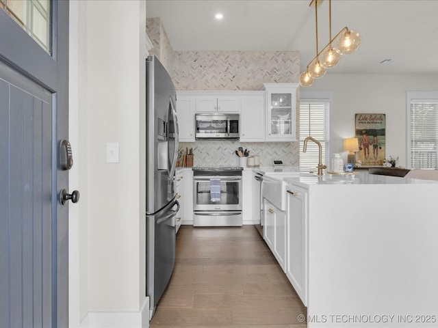 42 Redbud St, Carlton Landing, OK 74432 - kitchen with stainless steel appliances, a sink, tasteful backsplash, healthy amount of natural light, and recessed lighting
