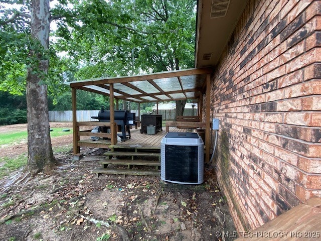 196 High Chaparal St, Ardmore, OK 73401 - wooden terrace featuring central air condition unit