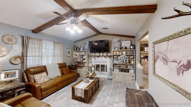 196 High Chaparal St, Ardmore, OK 73401 - living room with ceiling fan, a glass covered fireplace, and wood finished floors