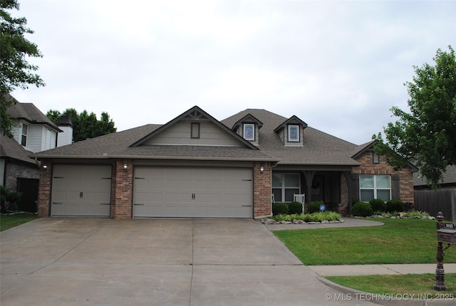 2025 E 134th St S, Bixby, OK 74008 - view of front of house with a garage, brick siding, concrete driveway, a front yard, and a shingled roof