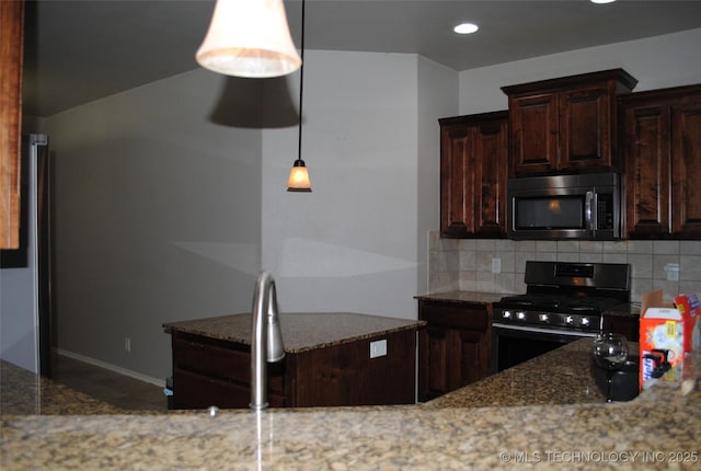 2025 E 134th St S, Bixby, OK 74008 - kitchen featuring stainless steel microwave, black range with gas stovetop, backsplash, stone countertops, and recessed lighting