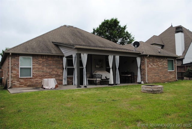 2025 E 134th St S, Bixby, OK 74008 - back of house with a fire pit, a patio, brick siding, roof with shingles, and a yard